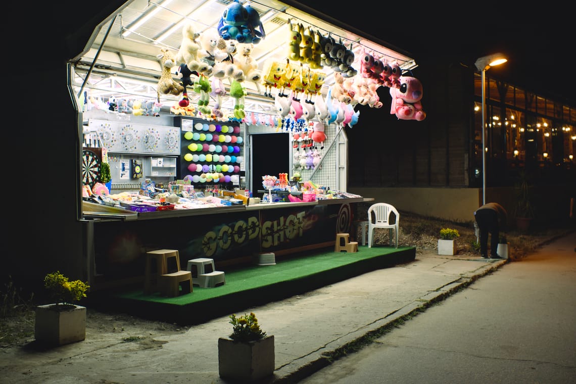 a shooting stand with lots off different plush animals. you can throw darts at balloons and win.